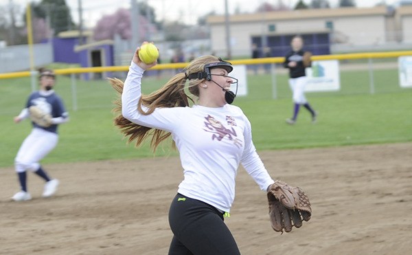 New third baseman Chloie Sparks makes a successful throw to first base at a recent practice. She is one four new full-time starters for the Wolves’ fastpitch squad. Head coach Mike McFarlen said newcomers are filling in just fine and the outfield may be one of the best in the Olympic League.