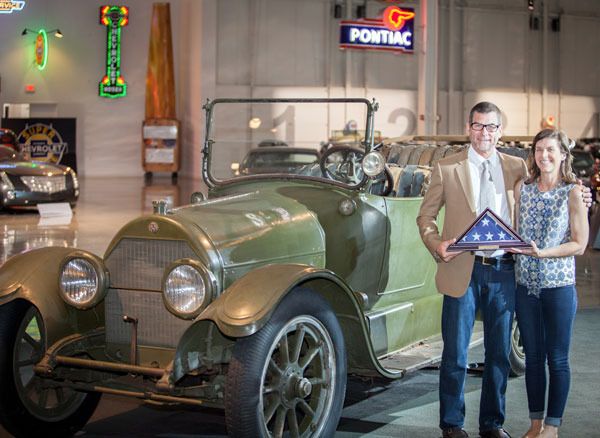 Owners Marc and Christie Lassen of Gardiner beam upon their 1918 V-8 Cadillac touring car