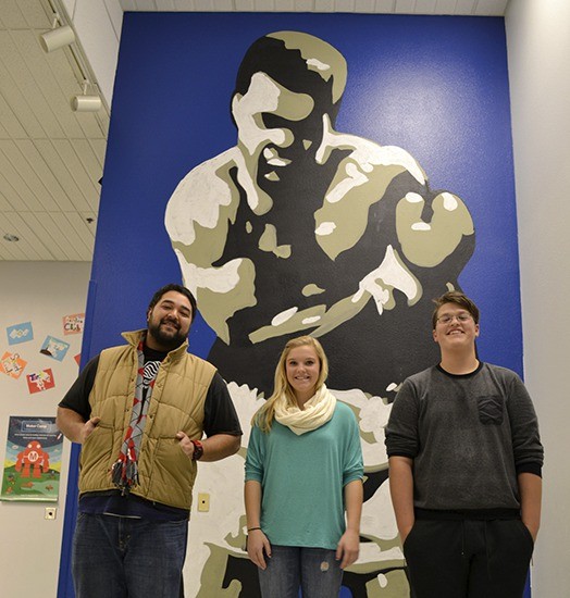 Muhammad Ali’s depiction towers over members of the Sequim Boys & Girls Club thanks to artists