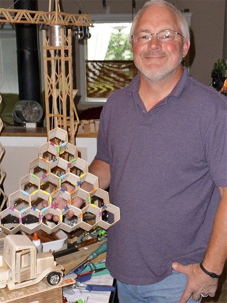 Sequim resident Brad Griffith said he was inspired by the honeycombs of bees for this art project. In the background is a working crane.