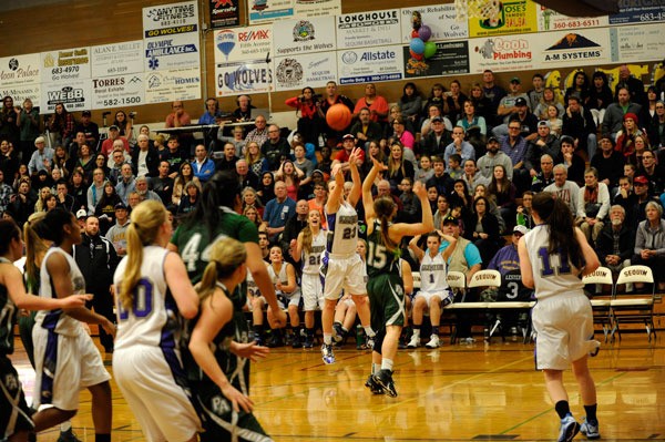 Sequim’s Jordan Miller lines up for her game-winning 3-pointer to end an eight-year losing drought to Port Angeles on Jan. 9.