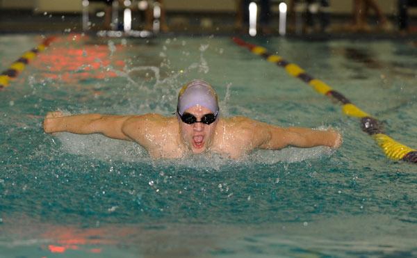 Sequim’s Eric Prosser swims the butterfly leg of the 200 medley as his Wolves take on North Kitsap in January. Prosser placed 14th in the 100 backstroke and 22nd in the 200 individual  medley at the state 2A swim meet last week in Federal Way.
