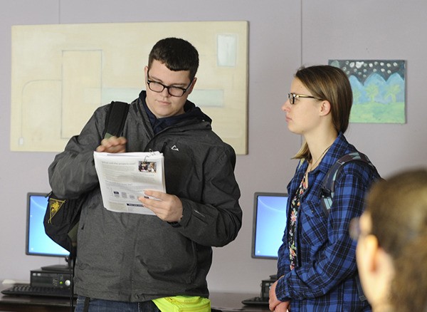 Sequim High students Taylor Bullock and Emily Webb present information about the Sequim School District’s construction bond proposal to classmates in early January