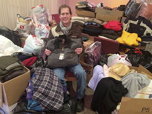 Drennan & Ford Funeral Home and Crematory co-owner Steve Ford sits with the hundreds of pieces of cold weather clothing donated by Clallam County residents as part of its recent “Sweaters for Veterans” collection drive. The cold weather clothing will be distributed to area veterans in need of such clothing during the winter months. This is the firm’s fifth year organizing this project and is part of its many annual and ongoing projects to assist veterans and active duty service personnel. For more information