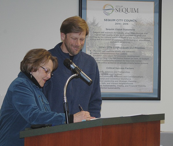 On Nov. 24 City of Sequim Mayor Candace Pratt and District 2 County Commissioner Mike Chapman sign a 30-year interlocal agreement between the city and county for wastewater treatment – summarizing years of work by city and county officials.