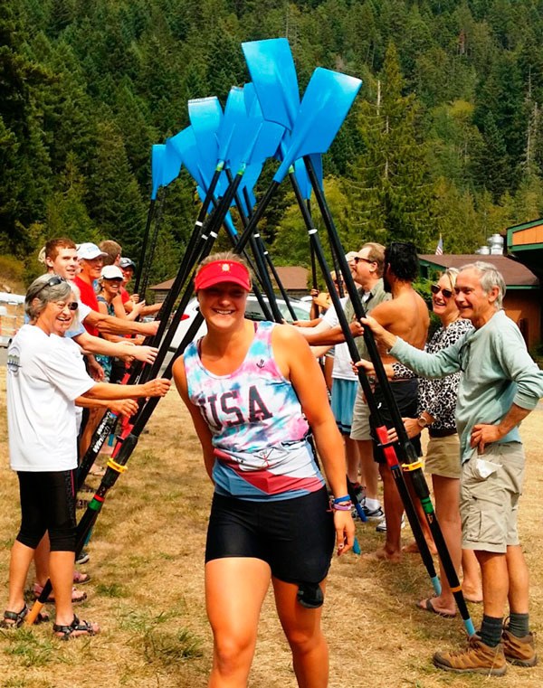 Members of the Olympic Peninsula Rowing Association host a victory celebration for Elise Beuke