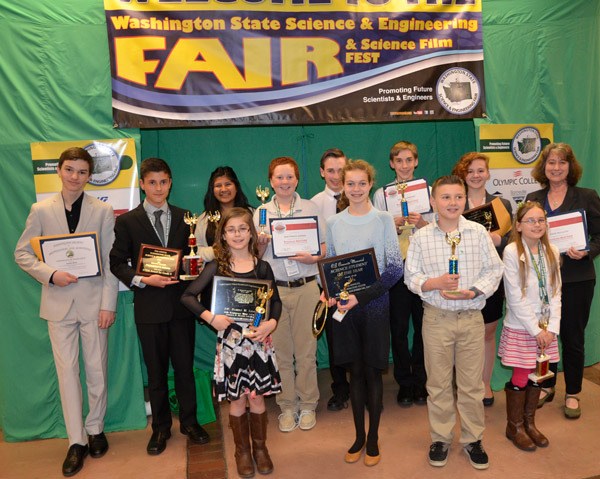 Sequim students and advisors celebrate a strong showing at the 59th Washington State Science and Engineering Fair in April. Pictured are (back row