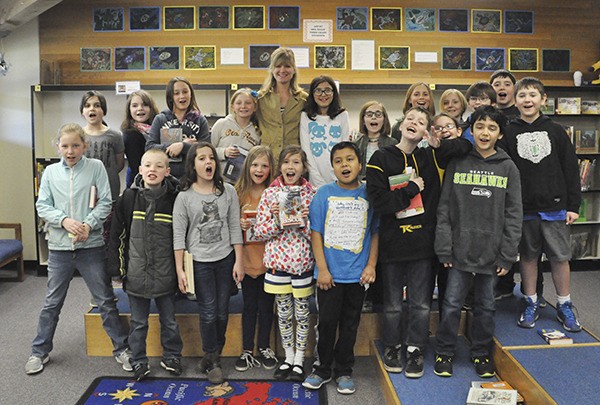 Patrick Caron’s fourth-grade class at  Helen Haller Elementary School joins author  Suzanne Selfors.