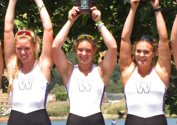 University of Washington rowers raising fifth-place trophies at the 2016 NCAA rowing championships on May 29 are