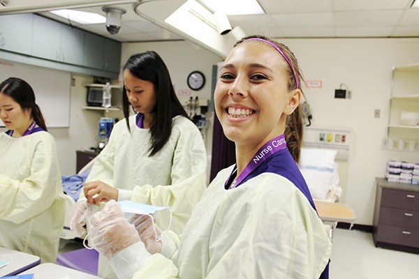 Tia Bourm of Sequim tries on protective gear and learns how to stay safe from pathogens as a nurse during the University of Washington’s Nurse Camp. She’s wanted to be a nurse for years since spending time in hospitals for treatment of her achalasia.