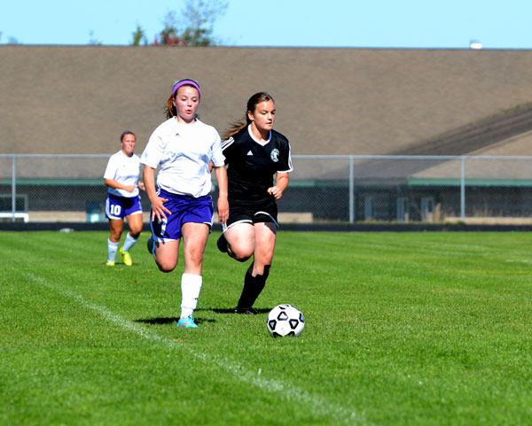 Aylee Bennett soars down the sideline toward the goal on Oct. 3. She scored two goals on the day to help give the Wolves a 4-0 win over Port Townsend.
