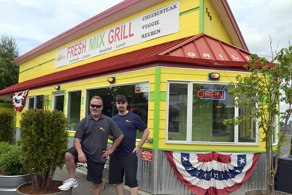 Father and son James and Joe Jeffko stand next to their business’ expansion that was paid for mostly by customer support. Clientele wanted more seats to bring family and friends to eat.