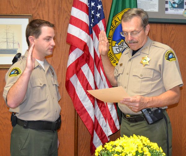 The Clallam County Sheriff’s Office welcomes new Corrections Deputy Mark Myers. He was sworn in by Sheriff Bill Benedict (right) on Sept. 29 in a brief ceremony conducted in the Sheriff’s Office.