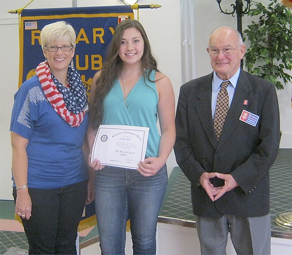 Sequim Noon Rotary President Christine Paulsen and Rotary District Governor Michael Procter present the club’s Student of the Month Award to Cecilee Wech on Sept. 11.