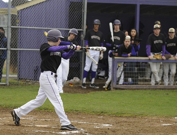 Sequim's Dusty Bates gets an infield single in the first game of a jamboree at SHS's fields on March 14.
