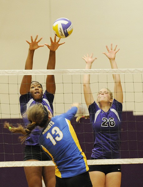 Adrienne Haggerty and Ella Christiansen go up for a block.