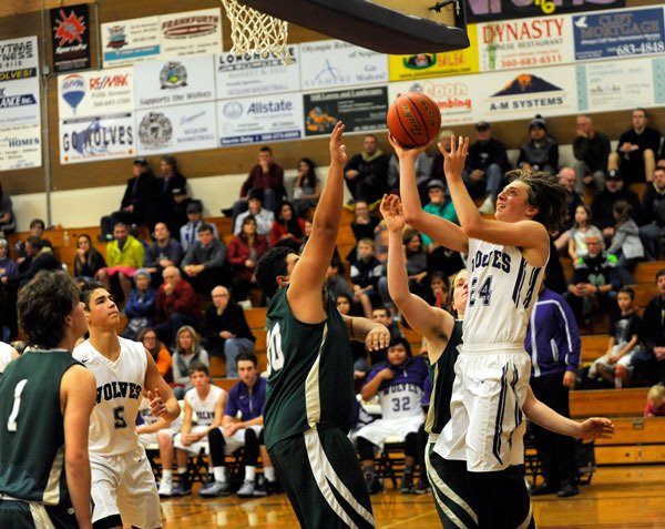 Nick Faunce goes in for a contested lay-up against the Klahowya Eagles on Dec. 4. He led all players with 12 rebounds.