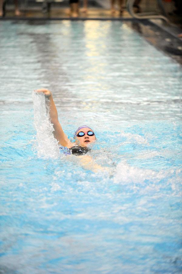 Sequim’s Stephanie Grow swims the last stretch of the 100 backstroke on Oct. 8