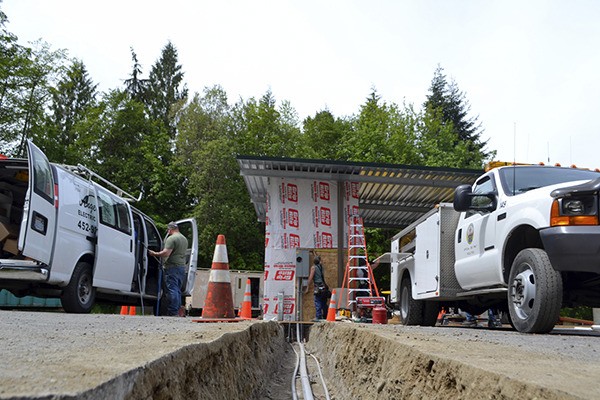 Clallam County Road maintenance crews and contractors work to rebuild the Blue Mountain Transfer Station on May 14 after a November fire burned it down. The facility is set to reopen this week.