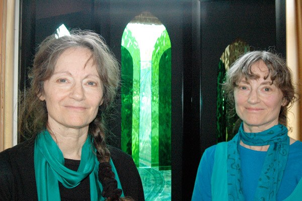 From left Sequim artists and twins Deborah Harrison and Dianna Sarto with their collaborative art piece made from layered water glass were inspired by the wild rivers of the Pacific Northwest to creatively convey the sacredness of water.