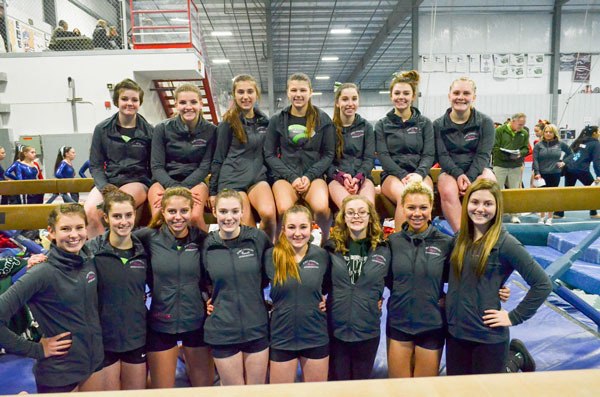 The Sequim/Port Angeles high school gymnastics squad is all smiles after setting 18 personal bests at a league meet at Poulsbo’s Breidablick Gymnasium on Jan 16.
