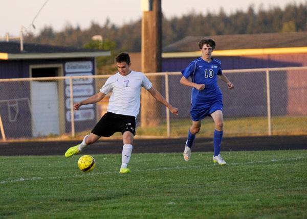 Thomas Winfield shoots past an Olympic Trojans player on May 7 in Sequim's final regular season game. He scored Sequim's lone game in a winner-enters-districts pigtail game on May 12 but the Wolves lost 2-1 to Clover Park.