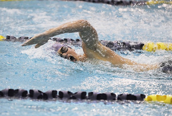 Eric Prosser swims the freestyle portion of the 200 IM as the Wolves take on Port Angeles in a home meet in January 2014.