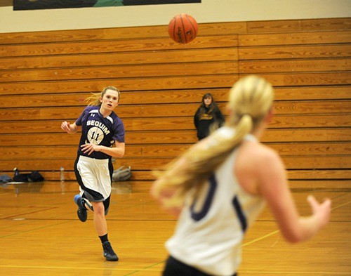 Victoria Cummins passes to Kylee Williams during a recent practice. Cummins said the girls are eager to win this year with six seniors playing.