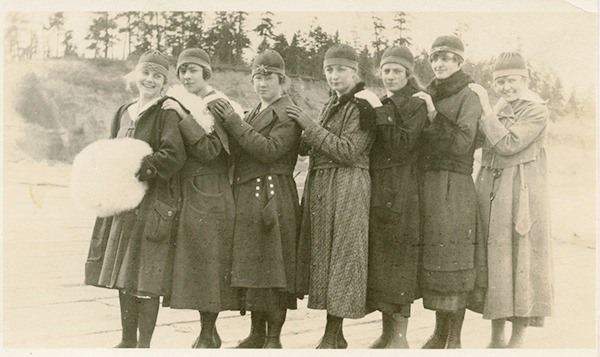 Members of the Sequim girls’ 1918-1919 basketball team wait on the Port Williams dock for a boat to take them to Port Townsend for a basketball game. Team members include (from left) Lou Woodcock