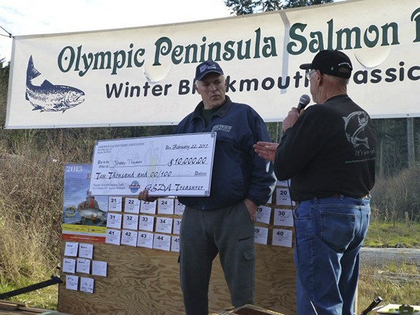 Jerry Thomas of Mount Vernon accepts his prize after winning the 2015 Olympic Peninsula Salmon Derby.