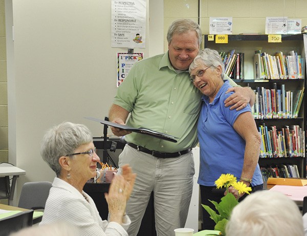 Volunteer Anne Olson is congratulated by Principal Russ Lodge for being selected to receive the Making a Difference award at the May 27 Haller Volunteer Reception.