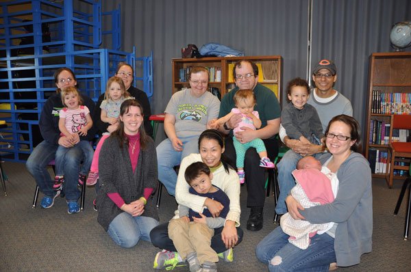 First Teacher families gather for a group photo after Monday Reading Time on Feb. 2 at the Sequim Boys & Girls Club. From left are Tiara Douglas with Lilly Purcell