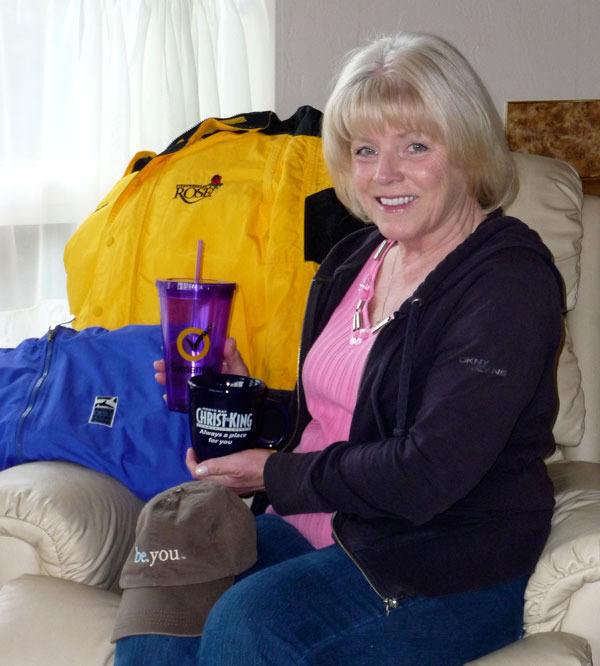 Advertising products entrepreneur Vivian Simonis poses with just a the few of the hundreds of items she can have logos put on.