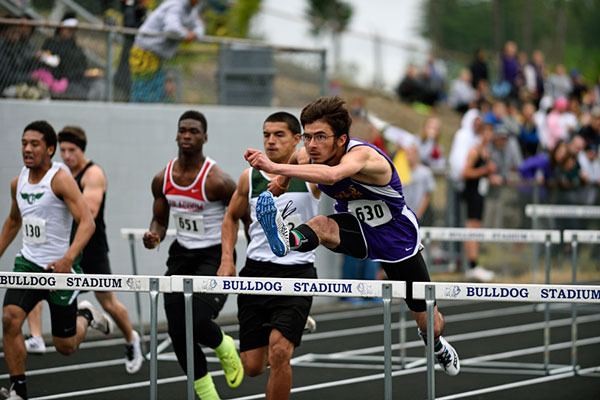 Sequim’s Oscar Herrera races to a top time in the preliminaries of the 110-meter high hurdles at the West Central District 2A track and field meet in Belfair on May 22. Herrera advanced to the state 2A meet in both 110- and 300-meter hurdles events.