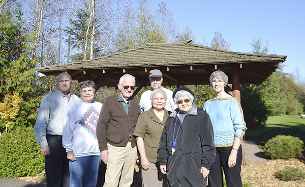 Advocates of Sequim's Friendship Garden at Carrie Blake Park celebrate a donation from three supporters at the garden's viewing pavilion in 2013. From left