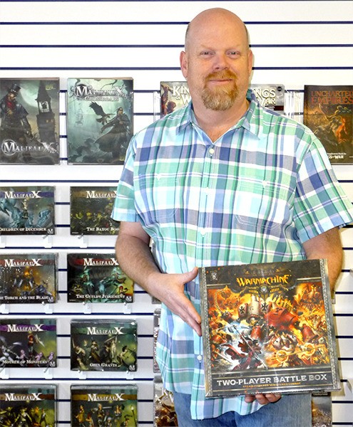 Gateway Games & Hobby owner Chris Francis favors playing miniature war games with 3-D figures such as WarMachine.