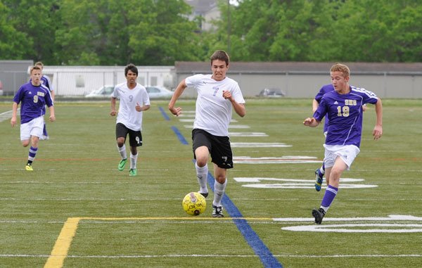 Sequim’s Thomas Winfield races toward Sumner’s goal as defender Owen Leenstra gives chase in the first half of the West Central District game on May 17. Winfield scored a first half goal to put Sequim up 1-0 by halftime