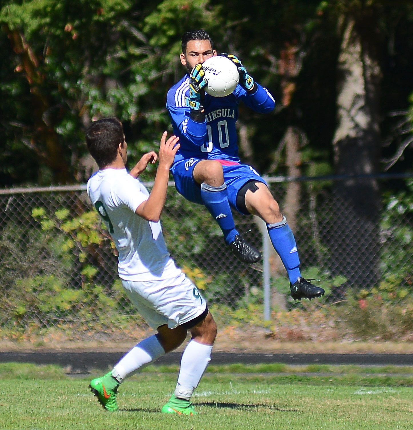 Peninsula goalkeeper Sergio Uribe makes a save in the Pirates' 4-3 win against Shoreline on Sept. 10. Photo by Jay Cline