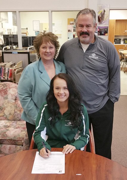 From a Wolf to a Gator: Sequim High senior Jordan Miller is headed to play basketball for Green River Community College this fall after signing a letter of intent last week. Here she is pictured with her parents Terri Miller and Dave Miller. Green River competes in the Northwest Athletic Association of Community Colleges.