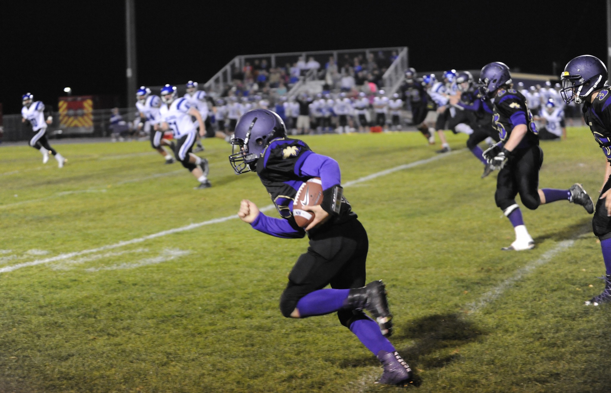 Sequim's Kyler Rollness looks for blockers after intercepting a North Mason pass in the Wolves' 47-12 win Friday night. Sequim Gazette photo by Michael Dashiell