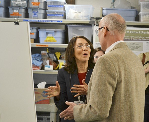 U.S. Sen. Maria Cantwell talks with Dr. Michael Huesemann of Pacific Northwest National Laboratory in Sequim about how they can replicate climates from around the world and its impact on algae. She visited the Sequim lab on July 1.