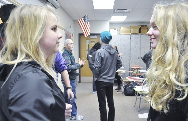 Sequim High School World Studies class students are encouraged to pair up to try to influence others to come around to their way of thinking on the choice of candidates during a “mock caucus” in Jack Webber’s World Studies classroom. Freshmen Joie Darminio (left) and Allison Van De Wege find they had reached a stalemate.