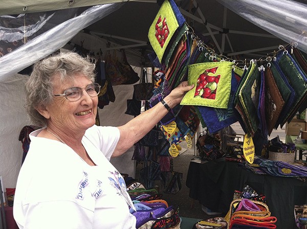 Sharon Ireton brings her cloth contraptions to the Sequim Farmers Market.