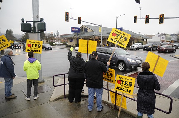 Sequim school bond advocates rally support at the corner of Sequim Avenue and Washington STreet in January.