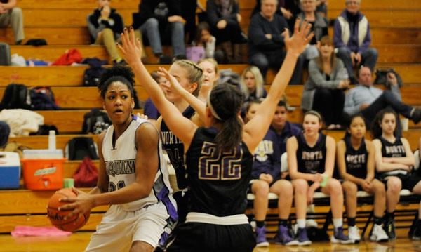 Sequim’s Adrienne Haggerty looks for an open teammate in the Wolves’ 58-34 loss to North Kitsap on Feb. 2. Haggerty had 11 points and a team-high 13 rebounds.