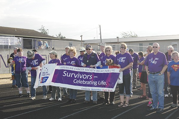 Relay For Life of Sequim participants in purple shirts denoted those who are cancer survivors.