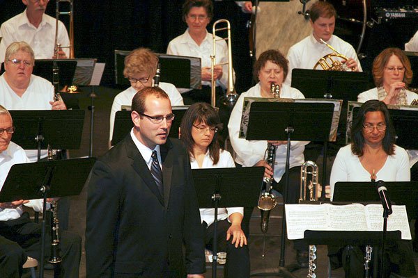 Then assistant band director Tyler Benedict waits to conduct the Sequim City Band during the Sequim Education Foundation’s Variety Show in 2013.