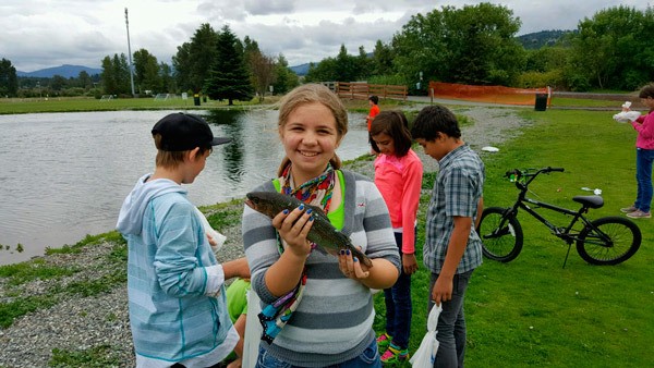 Madison Reynolds holds a trout