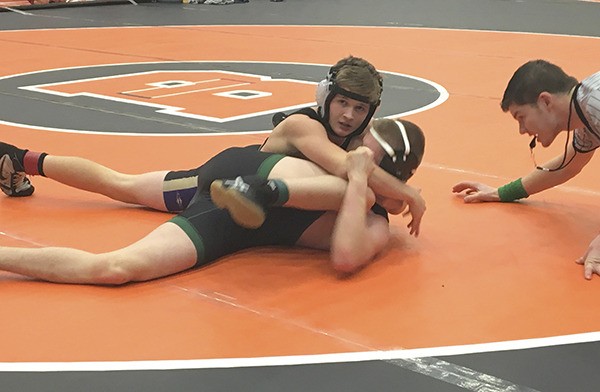 Ben Newell pins Jacob Day of Sehome in the opening round of the 132-pound bracket in the Battle at the Border in Blaine on Dec. 11-12. At the tournament