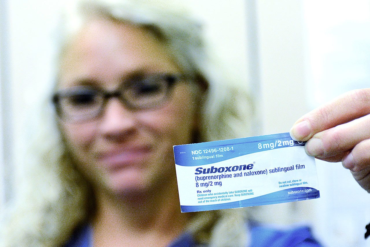 Julia Keegan, health services administrator, holds up a Suboxone strip, a drug the Clallam County jail uses to treat heroin and opioid addicts. The jail was the first on the West Coast and the only in the state to use medically assisted treatment for heroin addicts. (Jesse Major/Peninsula Daily News)